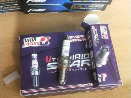 "UMA Racing Spark Plug designed for high-performance motorcycles, delivering enhanced ignition and fuel efficiency."