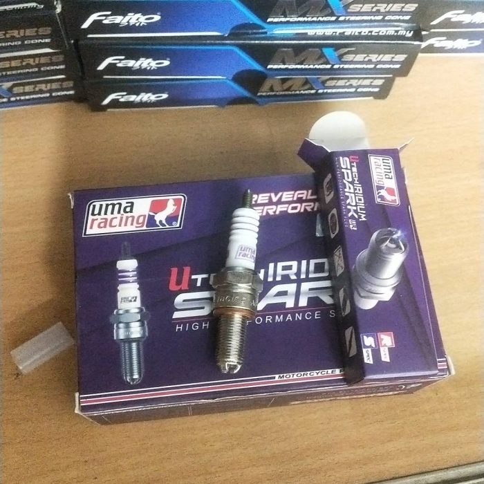 "UMA Racing Spark Plug designed for high-performance motorcycles, delivering enhanced ignition and fuel efficiency."